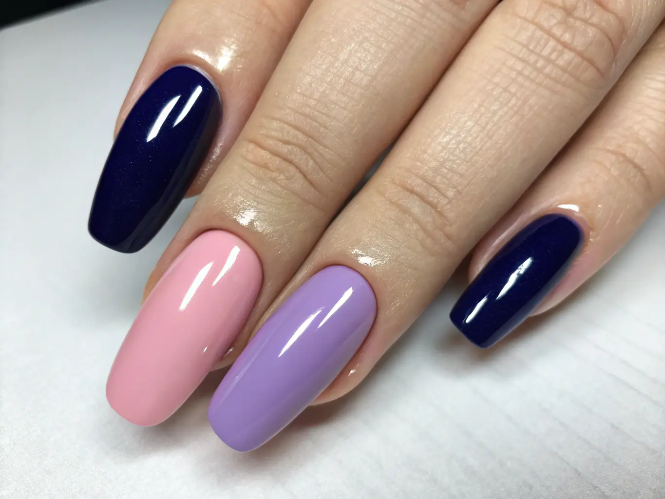 Image of nails with glossy gel or Shellac polish in various colors, highlighting the durability and shine of the service.
